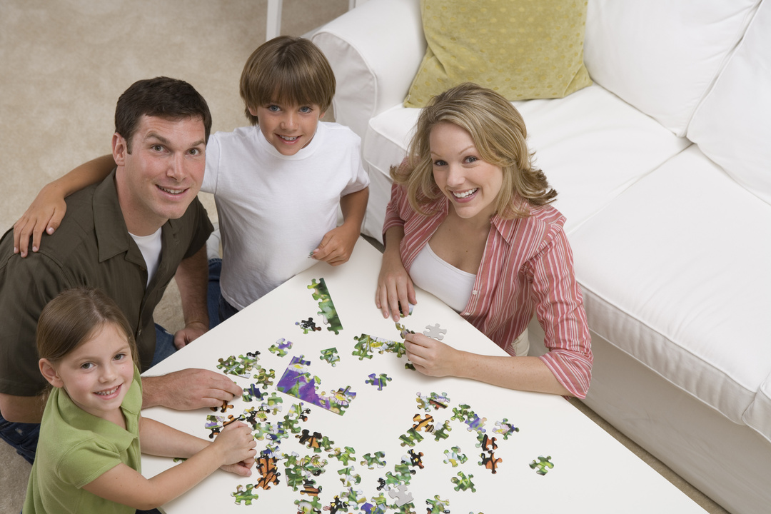 Family putting together a puzzle